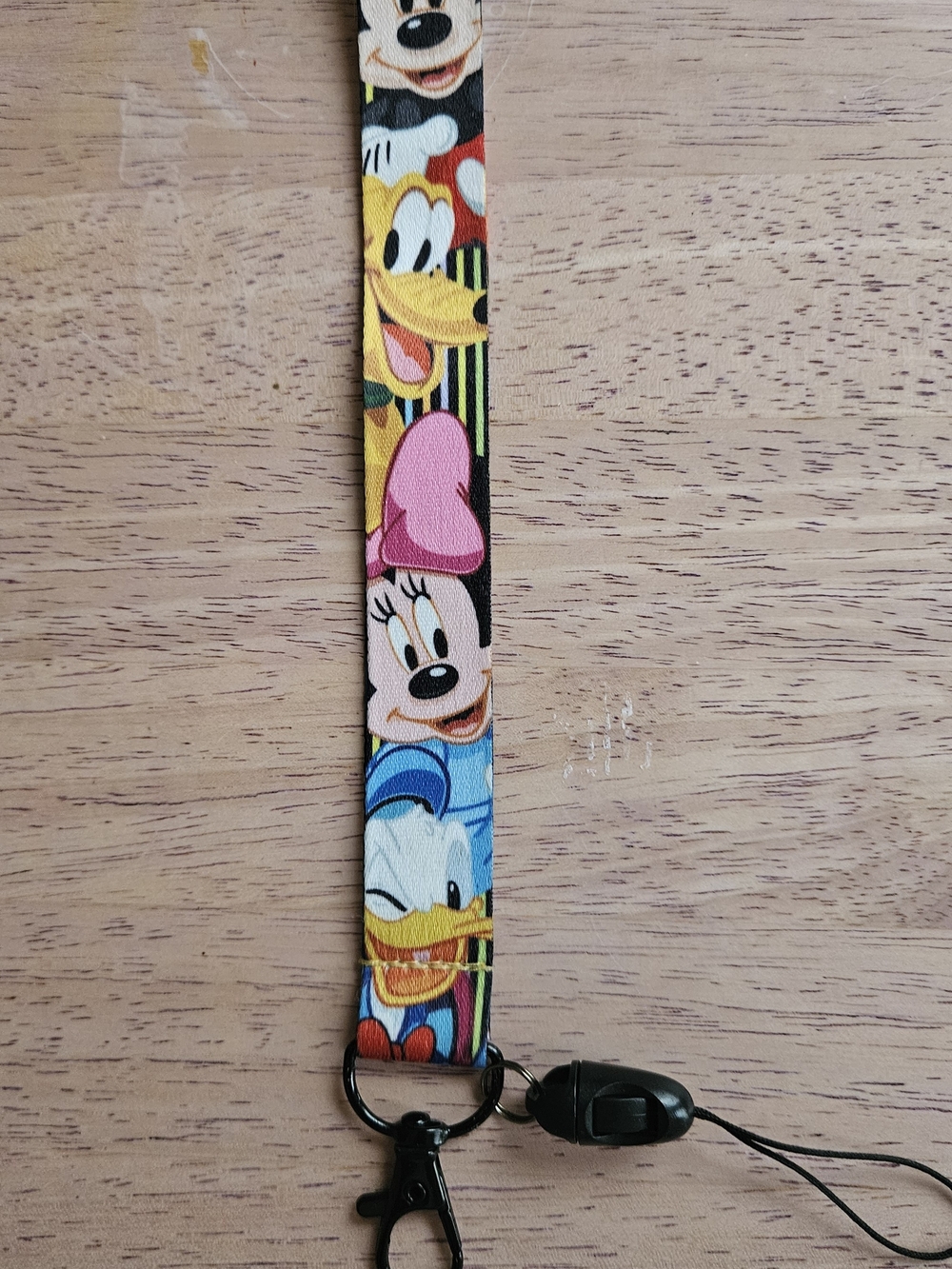 Disney Multi-Character Kids Lanyard in Pink, Blue, Yellow and Black.